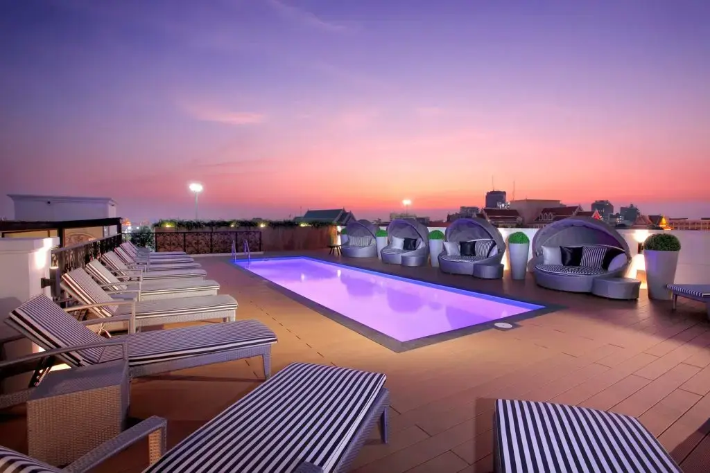 Villa De Khaosan rooftop pool at sunset